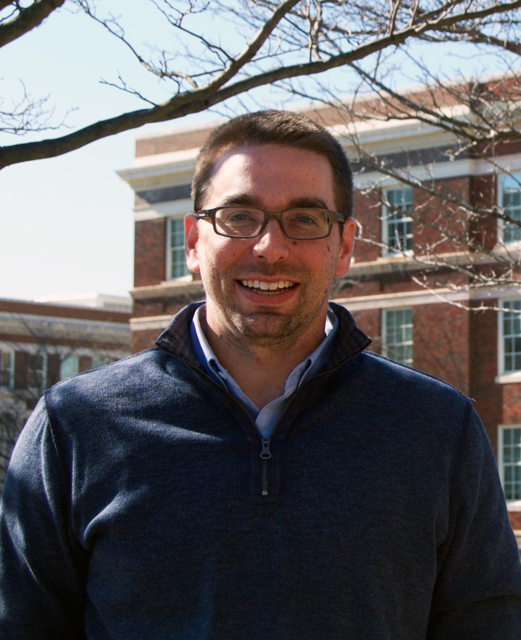 Casual headshot of Mark Mitchell on the UC campus.
